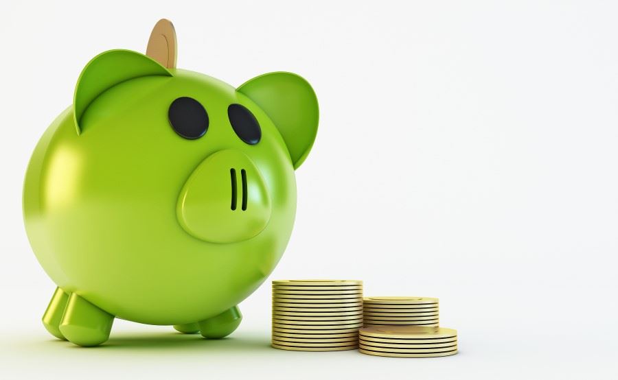 Piggy bank with pile of money